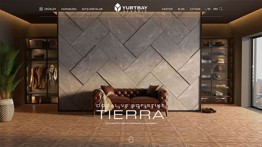 Yurtbay Seramik web sitesi projesini anlatan proje detay görseli, Görsel Yurtbay Seramik'e ait ürünle kaplanmış duvara sahip bir şirket bekleme alanını göstermektedir.